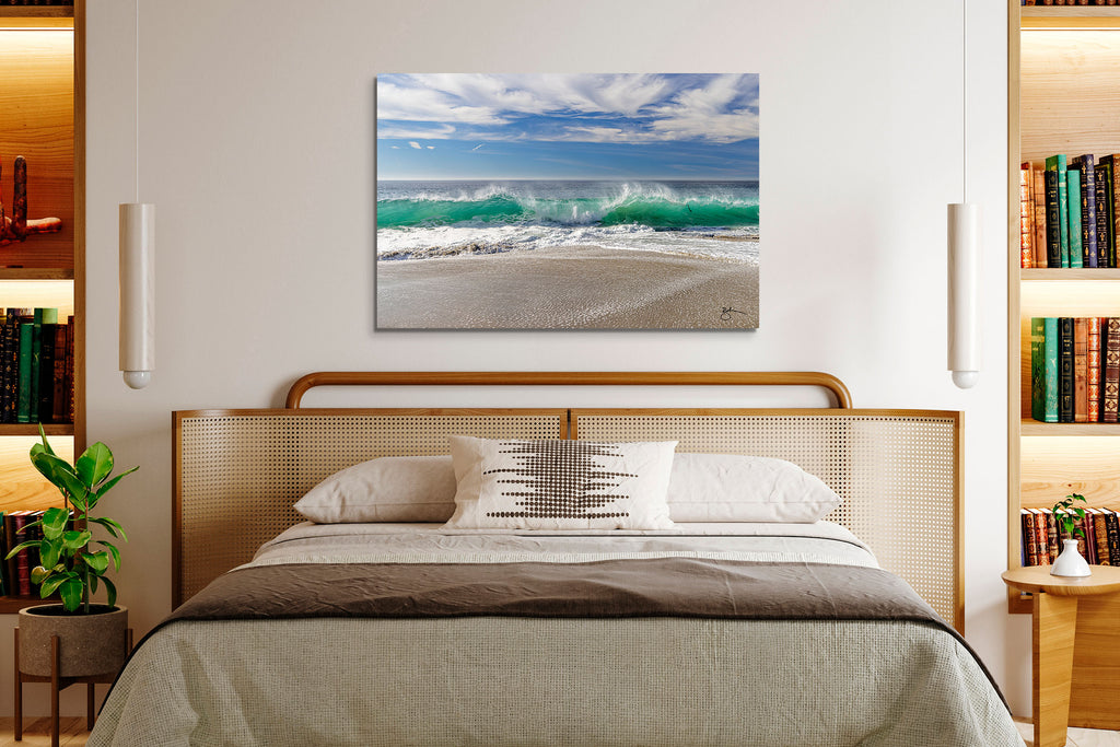 Christmas in Laguna coastal fine art on metal canvas is like a perfect day at the beach. The crystal turquoise water shot-through with sunlight dances toward the shore with the most perfectly beautiful wave cresting at center-frame. It's an elevated spin on coastal fine art by Laguna Beach artist Breck Rothage.