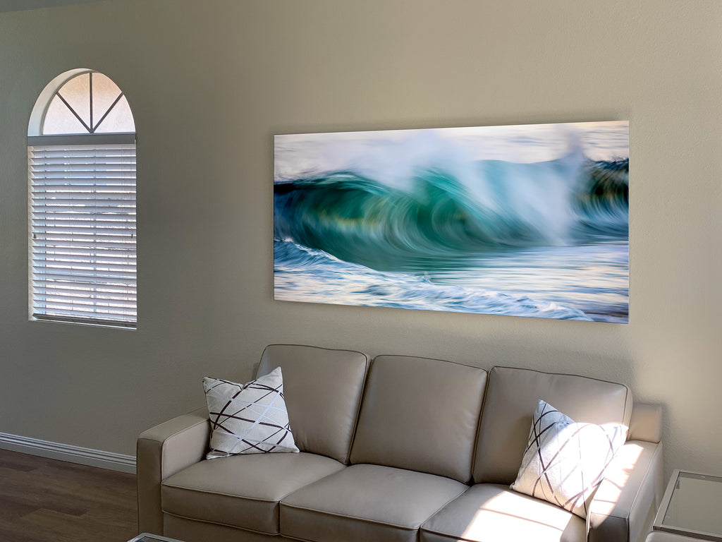 716am Fine Ocean Art at 6 ft. installed in Yorba Linda, CA. - An incredibly popular work, 716am is soft like an early morning California beach walk, available in sizes all the way up to 16 ft. The sea spray showers the crest of the wave as it barrels toward the Newport shore in the early morning light. The soft pinks on the horizon contrast with the aqua of the wave making this restful moment in time at The Wedge a beautiful choice to adorn your wall.